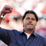 Mauricio Pochettino gestures to supporters as he walks off the pitch after the United States beat Bosnia-Herzegovina at the World Cup