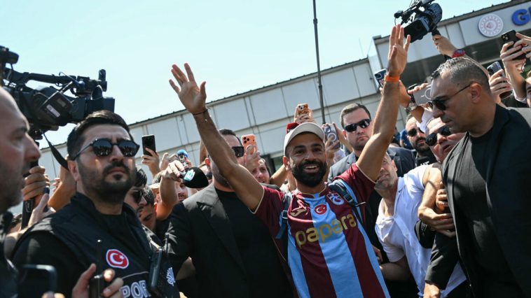 Mohamed Salah greeted by hundreds of ecstatic supporters on his arrival in Istanbul