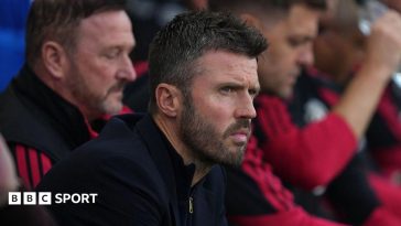Manchester United head coach Michael Carrick watches from the touchline during his side's 1-1 draw at Fulham
